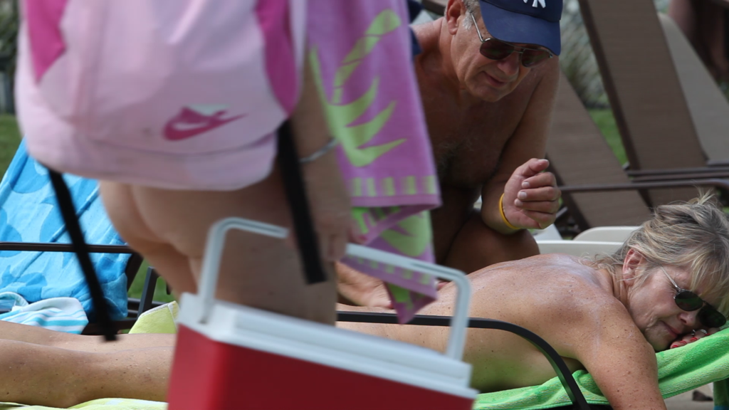 Pine Tree Nudist Club members enjoying the sun and outdoor pool.