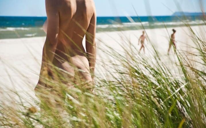 Nudist beach scene.