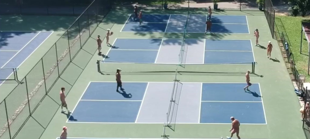 The busy pickle ball courts at Pine Tree Associates nudist club